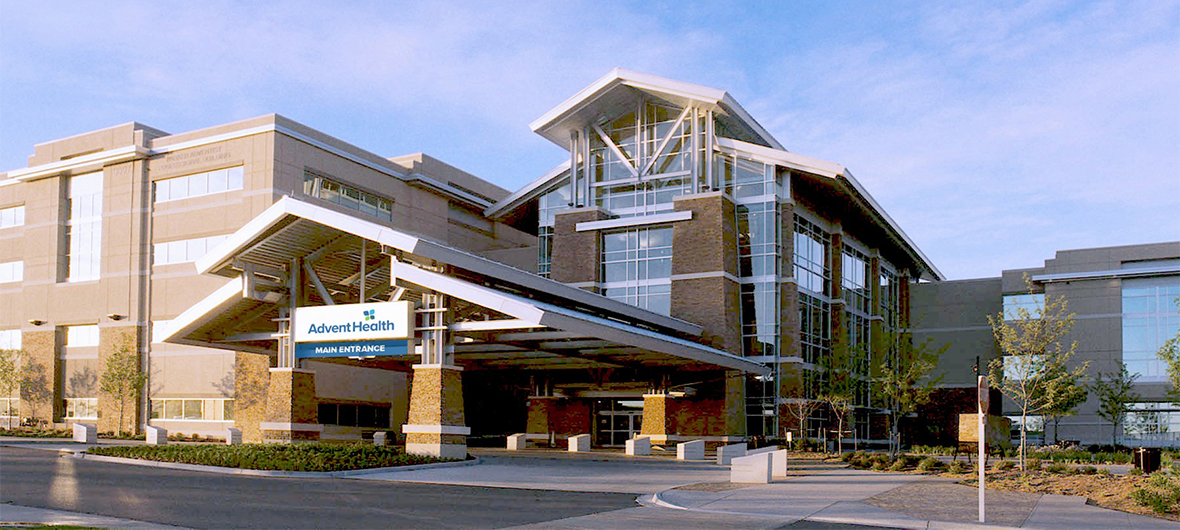 Exterior view of AdventHealth Parker hospital, a modern medical building with a prominent sign.